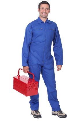 Man wearing blue overalls holding tool kit